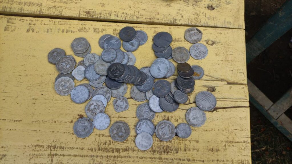 Woman duped into buying old coins