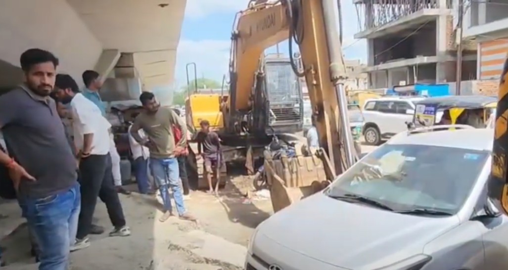 A JCB hit a car parked in front of a private hospital in Rewa