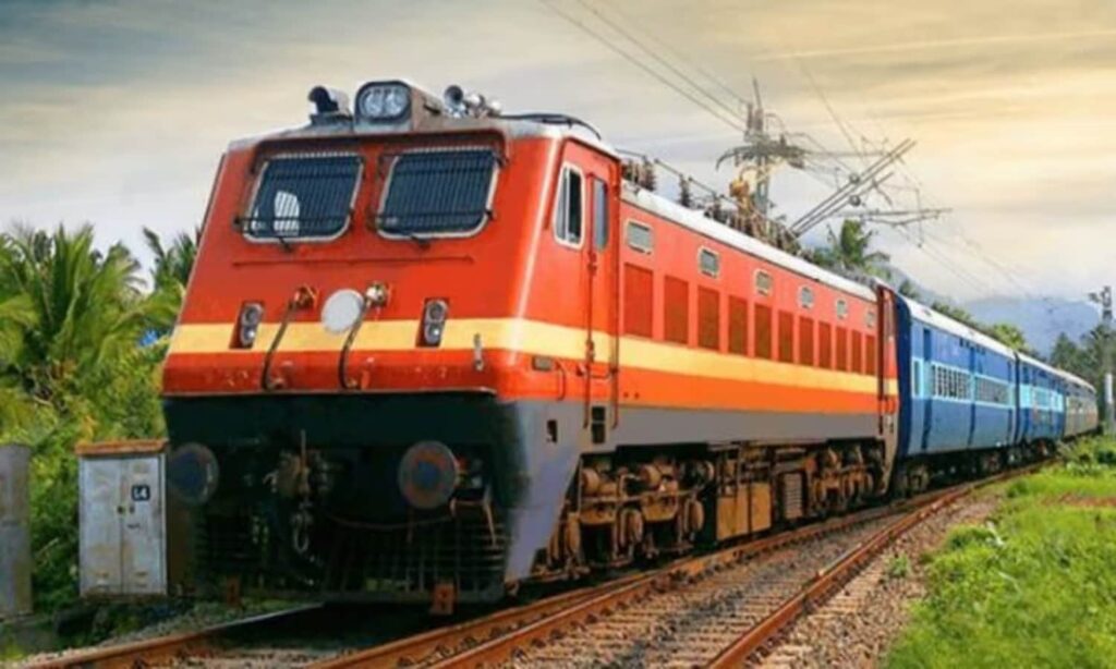 Passengers standing in front of AC and SL coaches of the train, understanding the upgrade options available in ticket booking