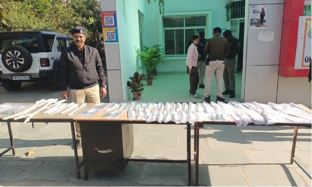 Police displaying seized sharp weapons after busting an illegal arms factory in Madhya Pradesh