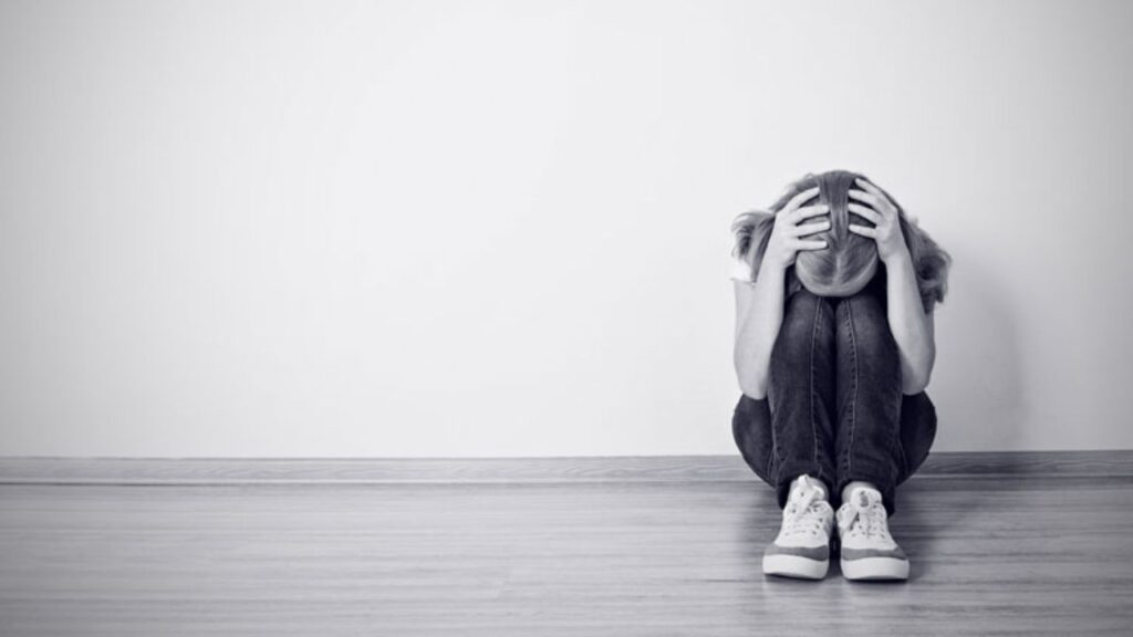 Illustrative image of a distressed person symbolizing mental stress and anxiety linked to heart health risks