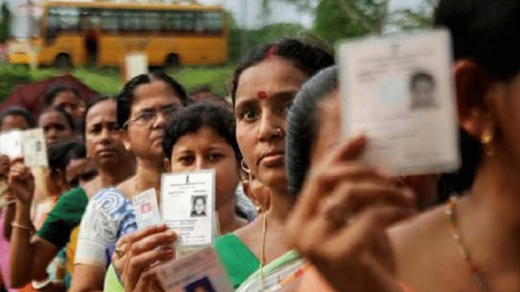 Voters stand in a queue holding identity cards during Arunachal Pradesh panchayat elections