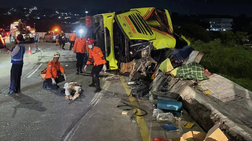 Rescue teams at the scene after a deadly bus accident in Indonesia with injured passengers