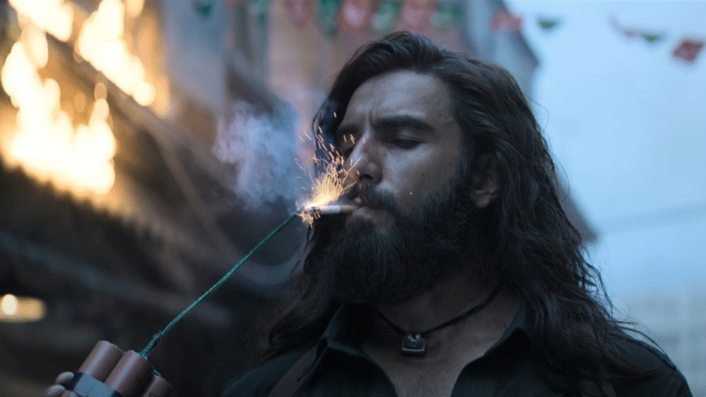 Actor in Dhurandar movie scene representing box office success of the film