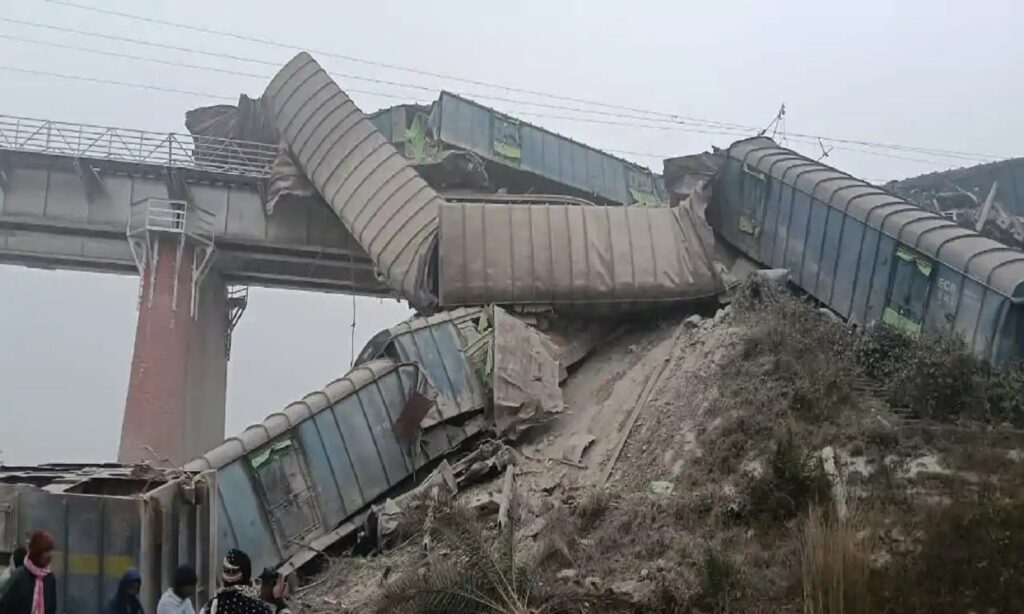 Derailment scene showing train coaches collapsed near a bridge in Bihar