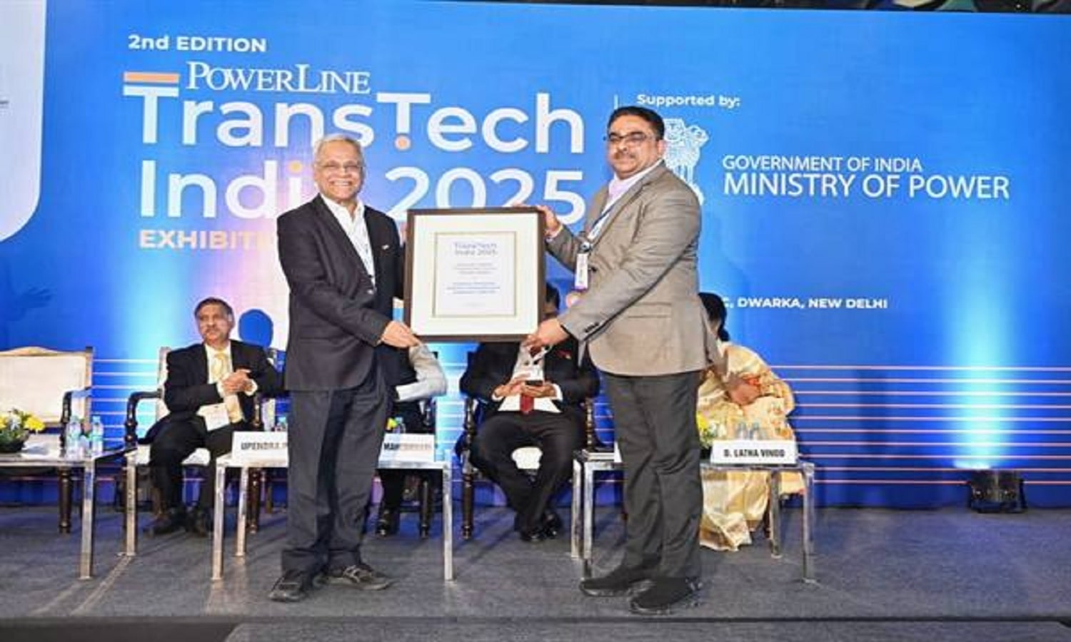 Officials present the Powerline Transtech India Award to Madhya Pradesh representatives at a New Delhi event
