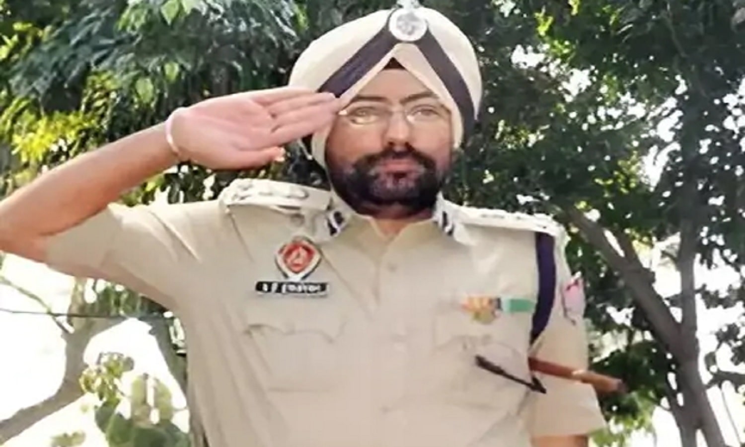 Former Inspector General in police uniform saluting during an official public event