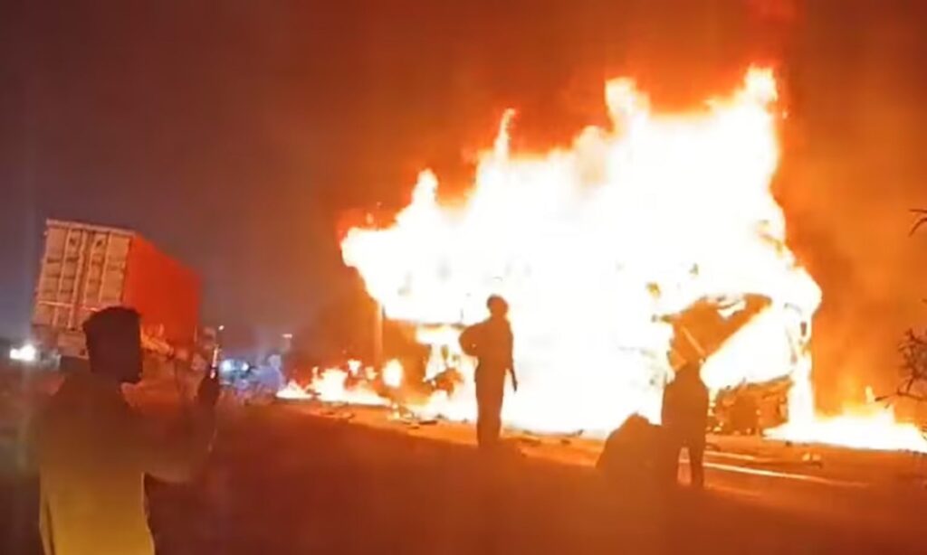 Sleeper bus engulfed in flames during a fire incident in Karnataka at night