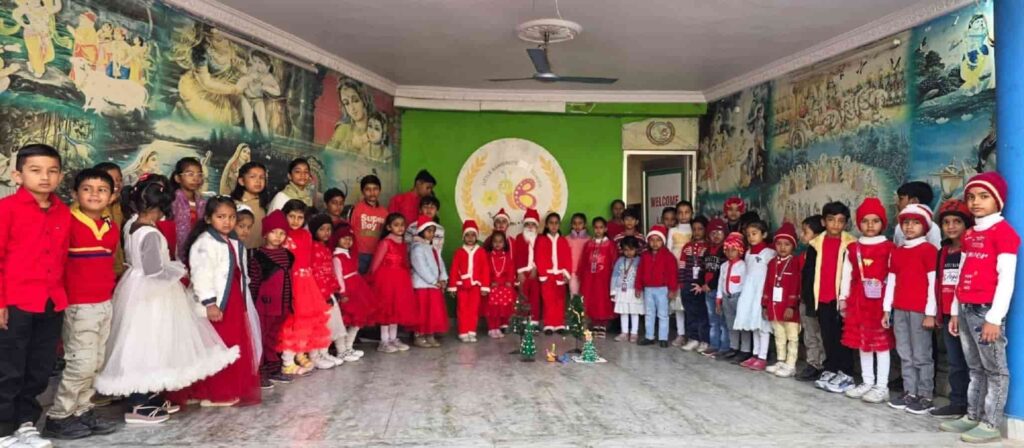 Children dressed in red and white outfits during Christmas celebration in Rewa