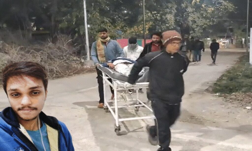 Police and civilians moving a body on a stretcher at night, illustrating a crime scene response.