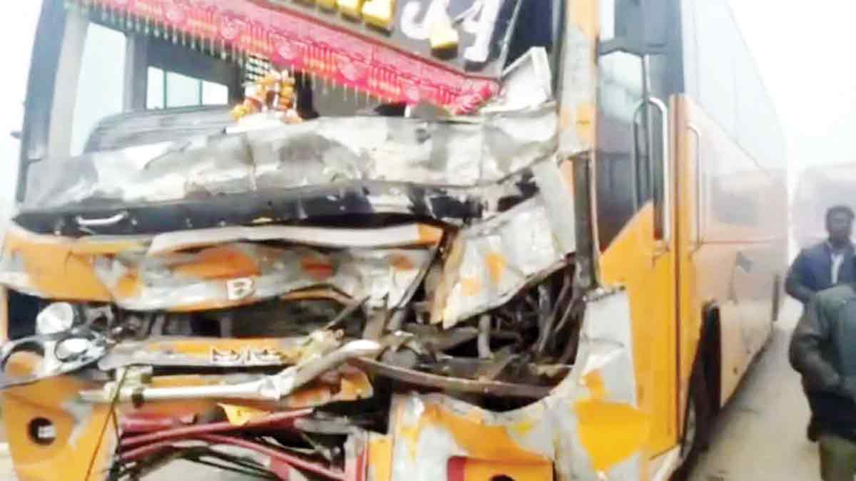 Wreckage of a silver SUV and a damaged orange bus involved in a fatal accident on Agra-Jaipur highway.