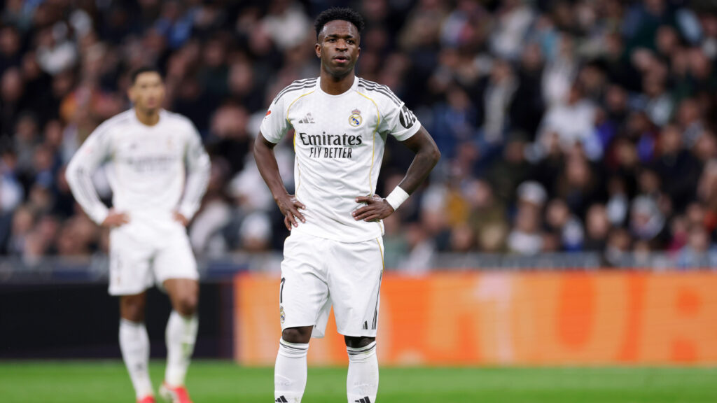 Vinicius Junior in Real Madrid jersey looking focused during Champions League match against Monaco at Bernabeu