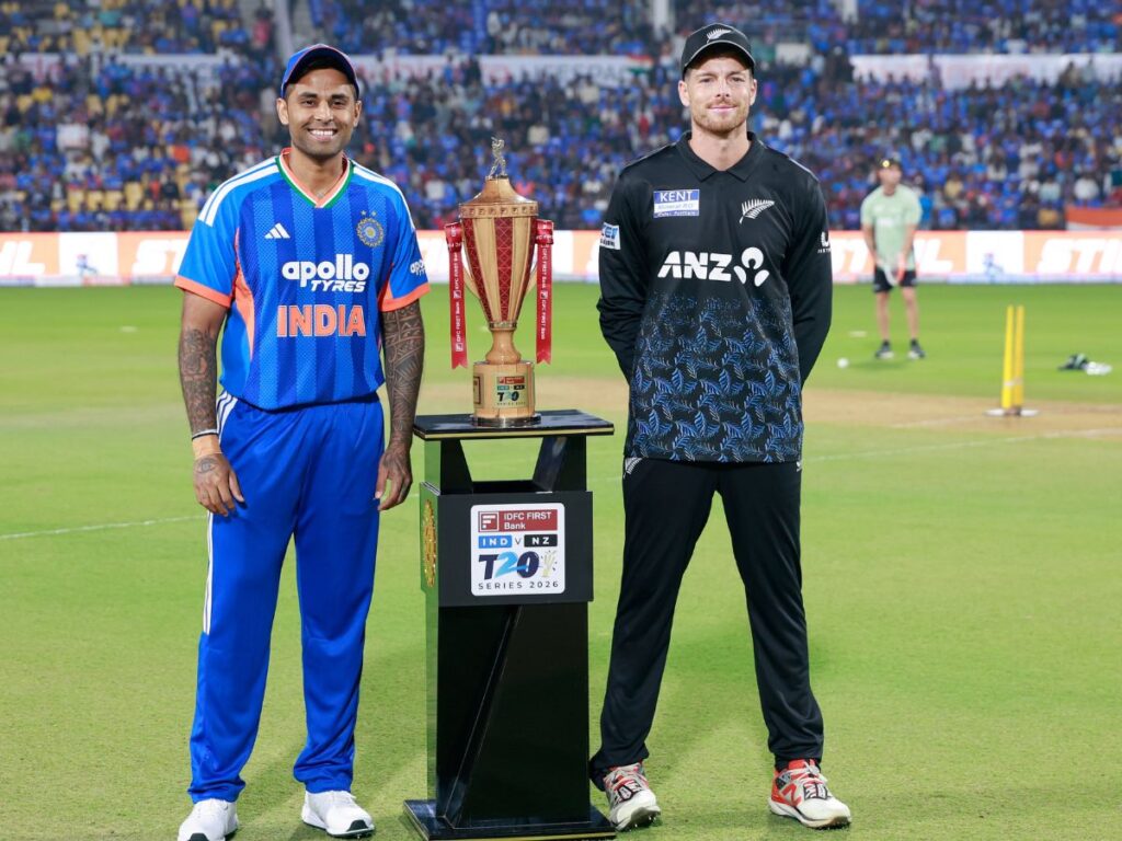Indian captain Suryakumar Yadav and NZ captain Mitchell Santner posing with the T20 series trophy