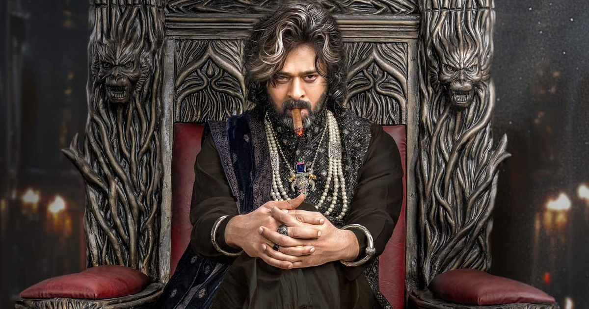 Actor seated on an ornate throne in Raja Saab film promotional visual