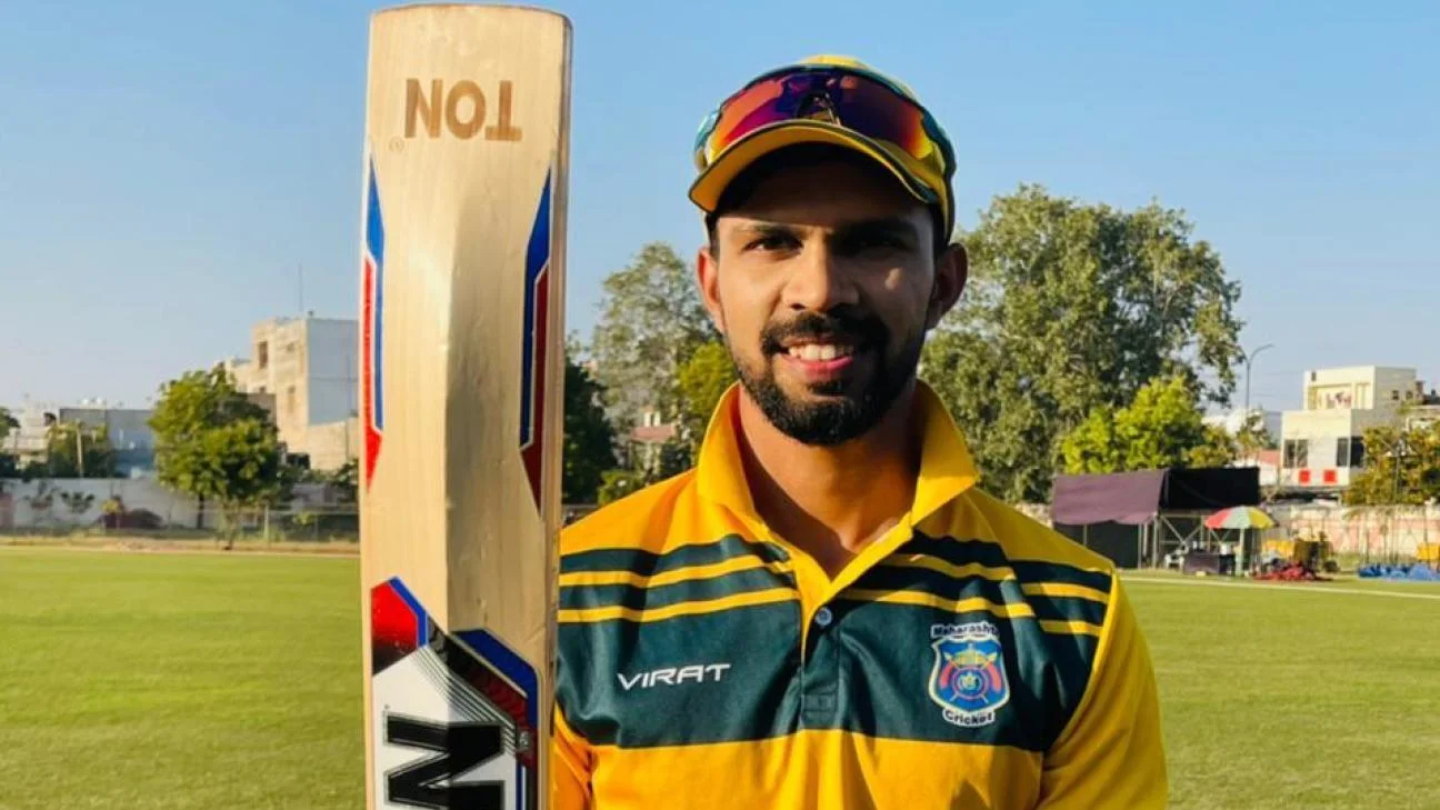 Ruturaj Gaikwad holding his bat after scoring a century during a Vijay Hazare Trophy match in India