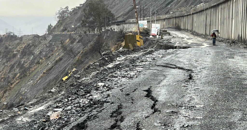 Cracks on Srinagar-Jammu National Highway road surface after a landslide triggered by heavy rains and snowfall.