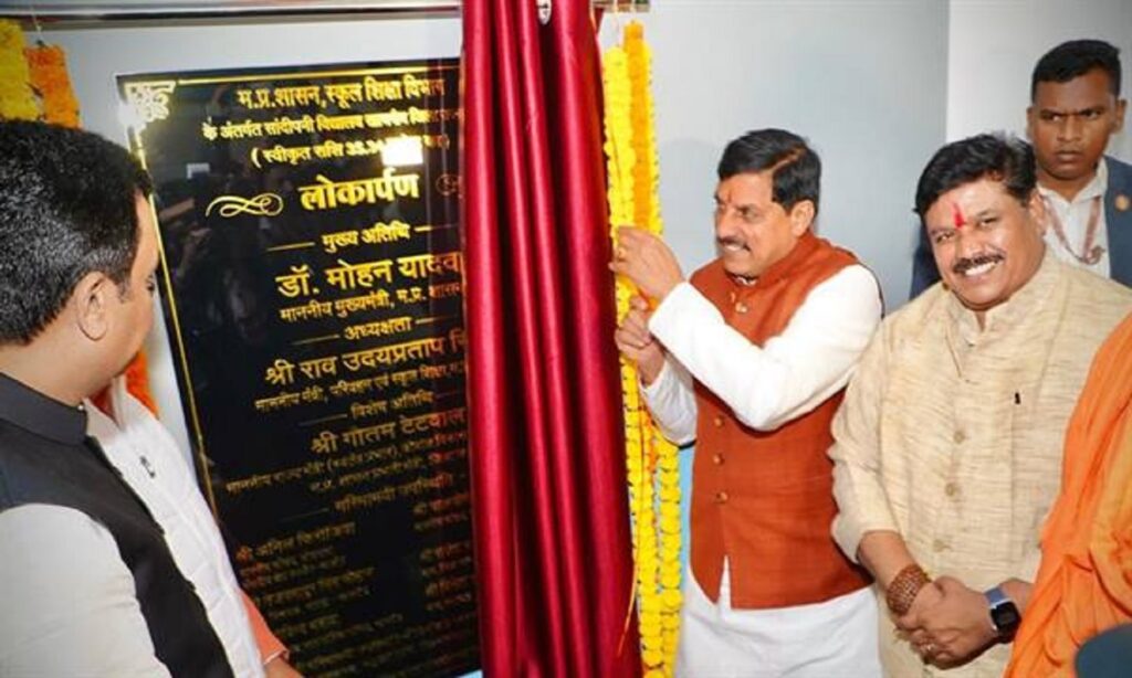 Chief Minister Mohan Yadav unveiling plaque during a government development program