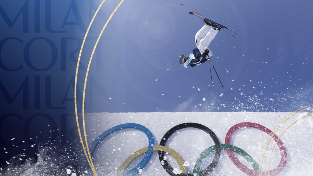 A freestyle skier performs a mid-air flip during the Men's Big Air event at the 2026 Winter Olympics.