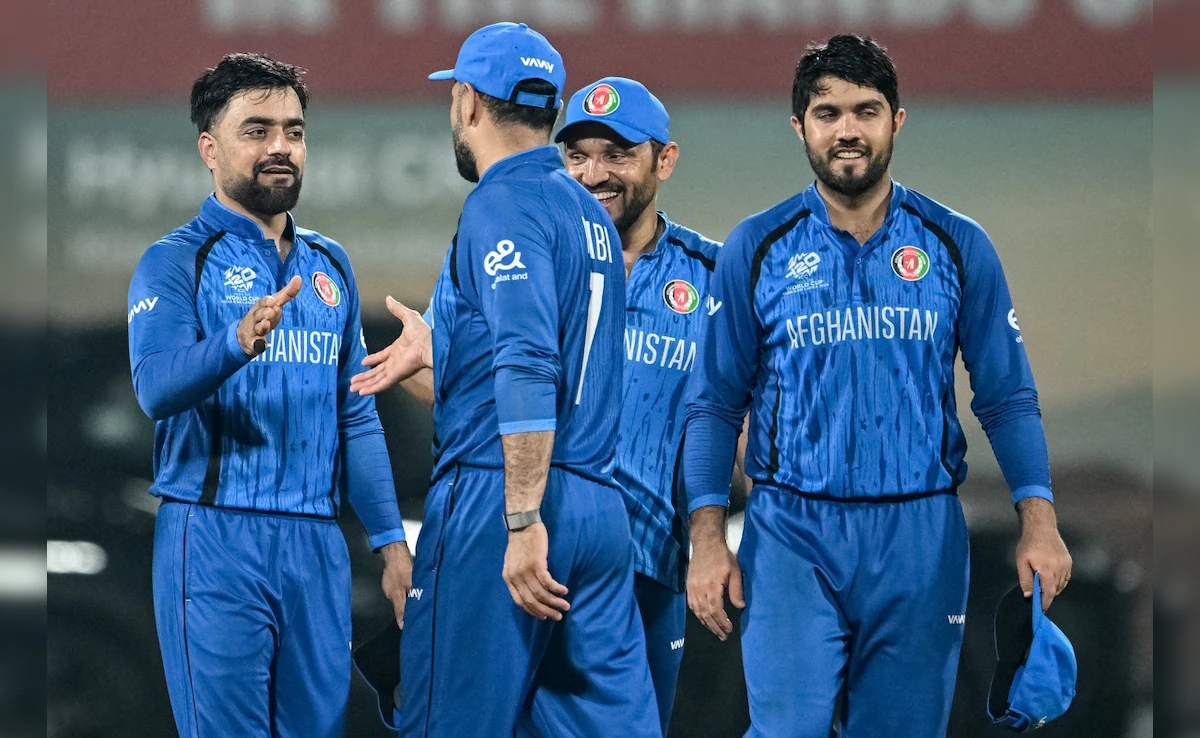 Afghanistan and Sri Lanka captains posing with the white-ball series trophy in the UAE.