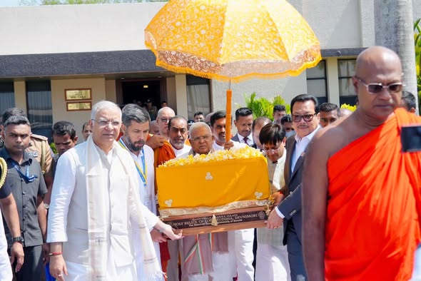Officials and monks carrying the sacred Devnimori Buddha relics in a golden casket during a ceremony.