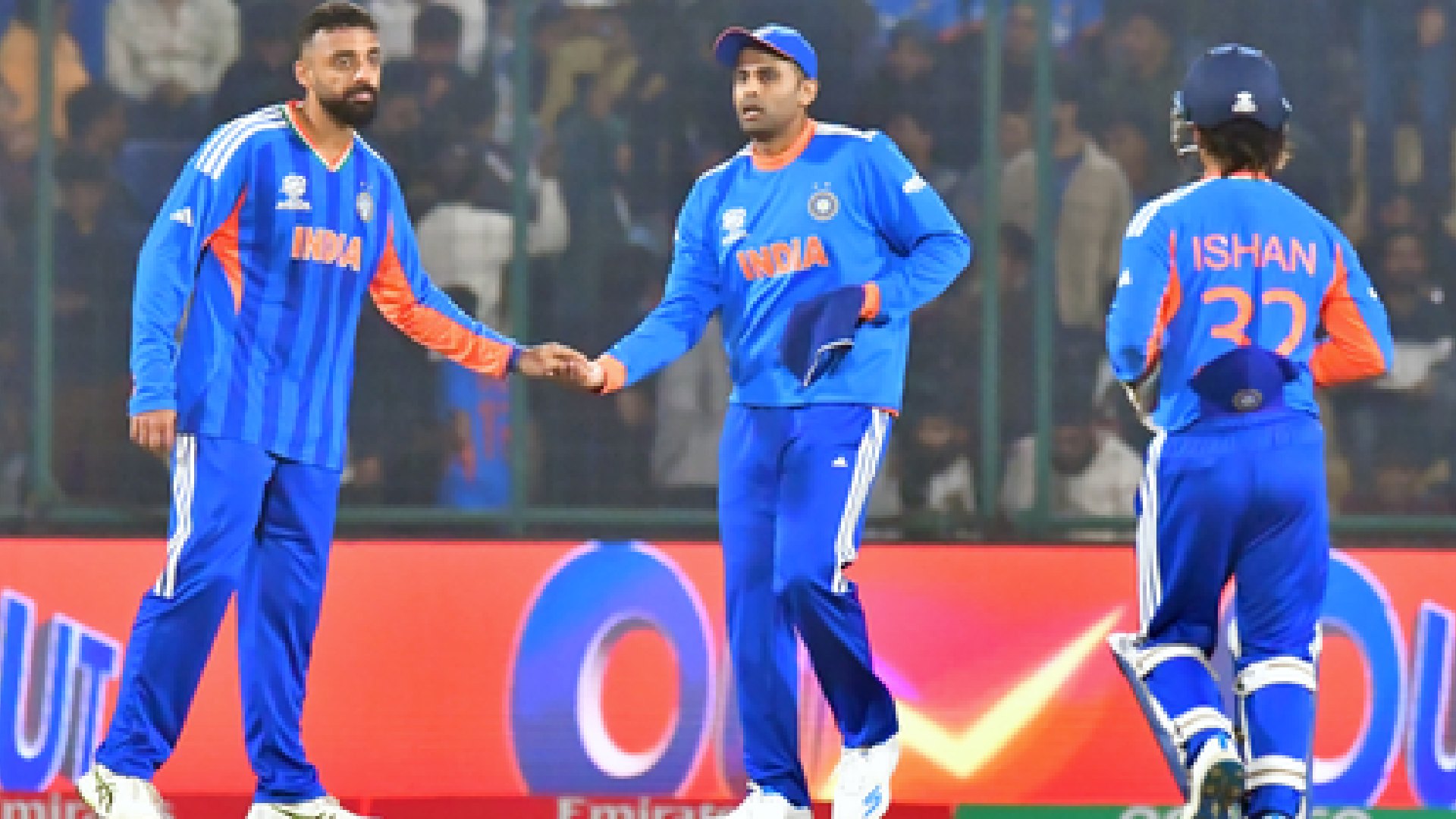 Varun Chakaravarthy celebrates a wicket with Ishan Kishan during India vs Namibia T20 World Cup match.