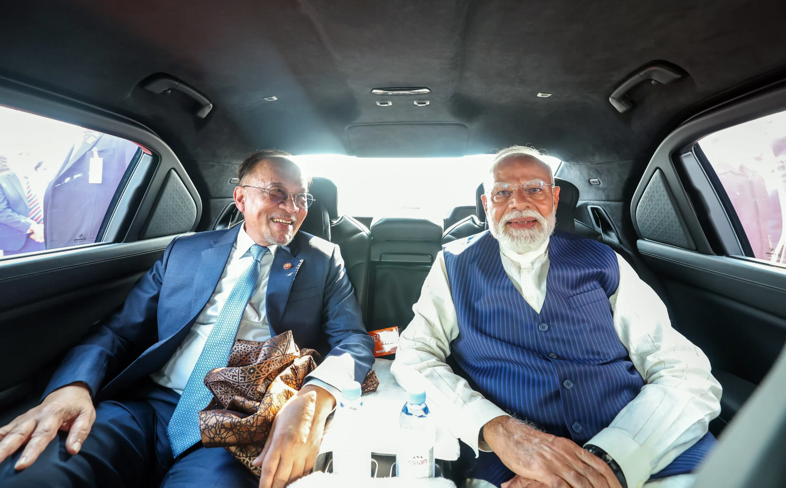 PM Narendra Modi and Malaysian PM Anwar Ibrahim sharing a candid moment inside a car during the state visit.
