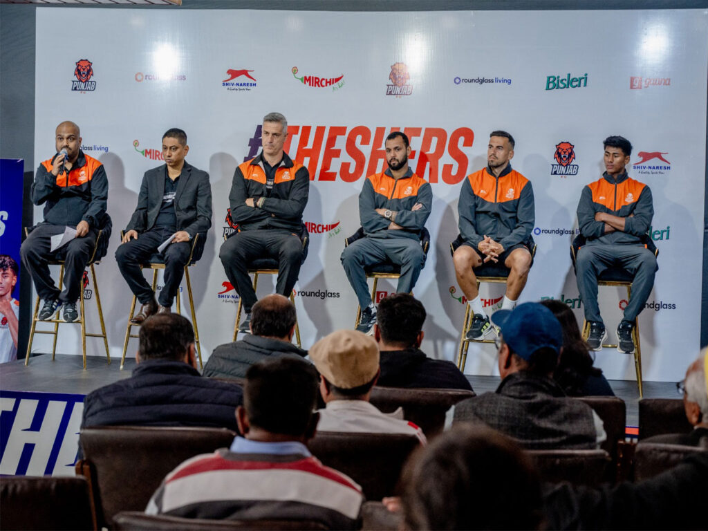 Punjab FC officials and players at the ISL 2025-26 squad announcement press conference.