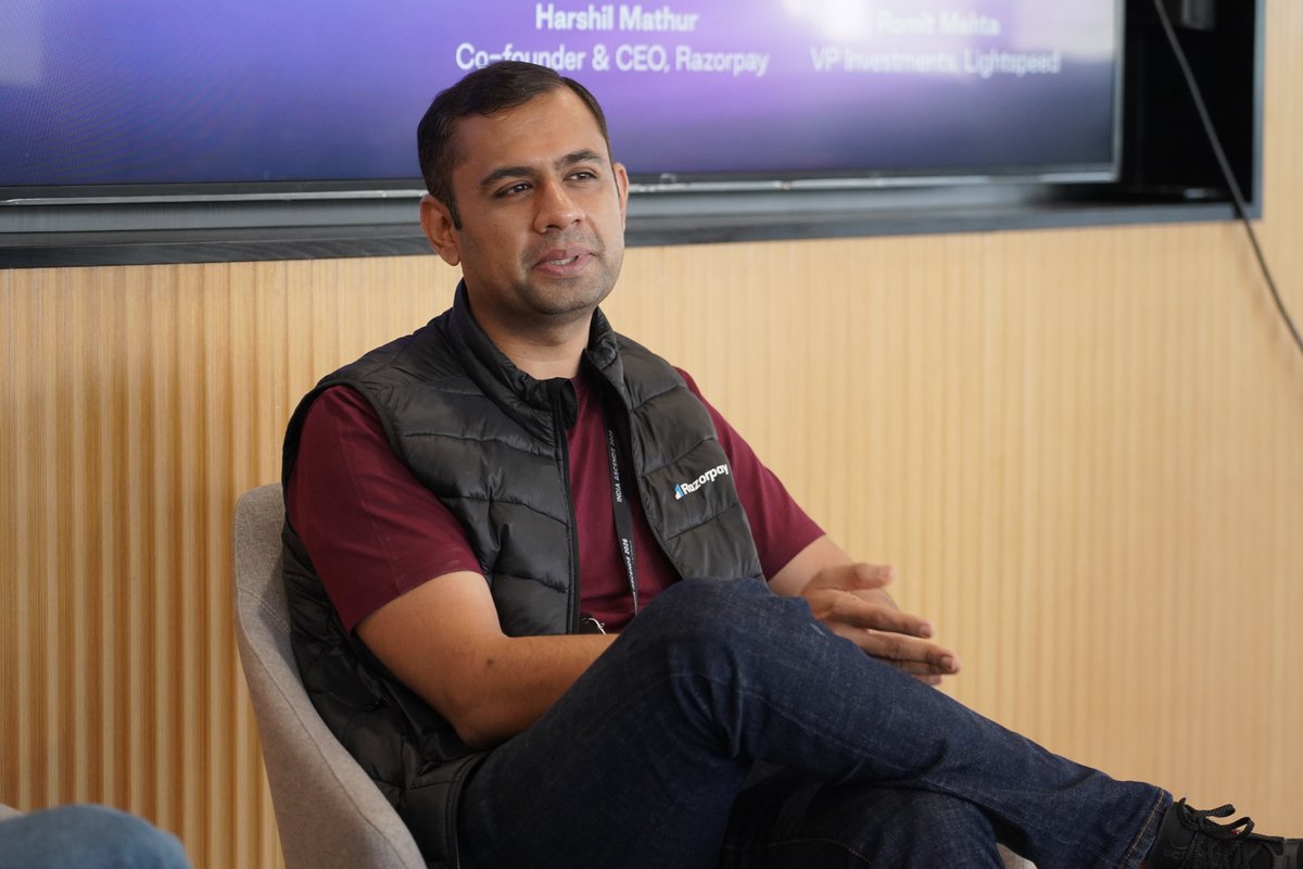 Razorpay CEO Harshil Mathur speaking about AI and agentic commerce at the India AI Impact Summit in New Delhi.