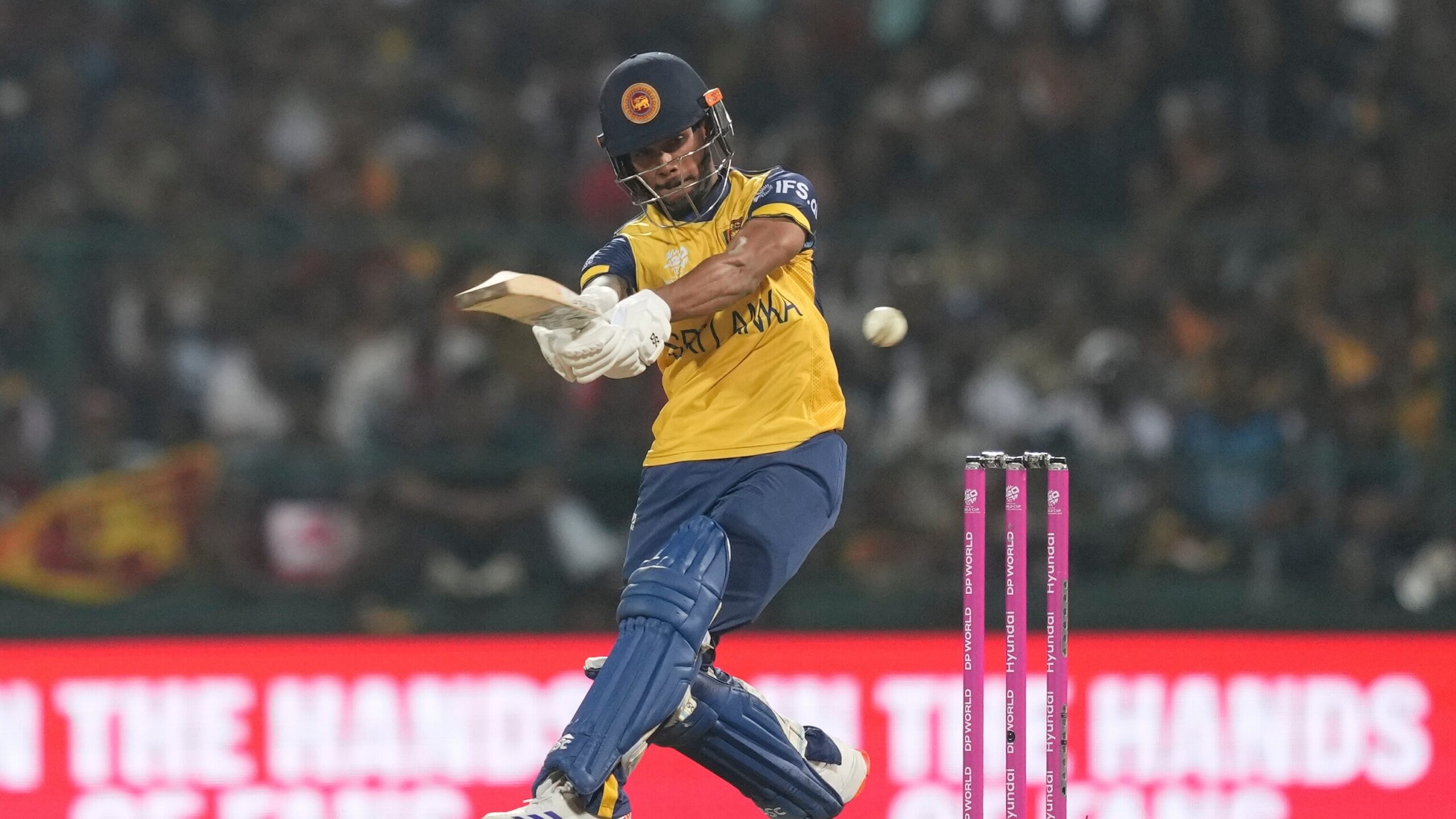 Sri Lankan batsman playing a sweep shot against Australia during the 2026 series.