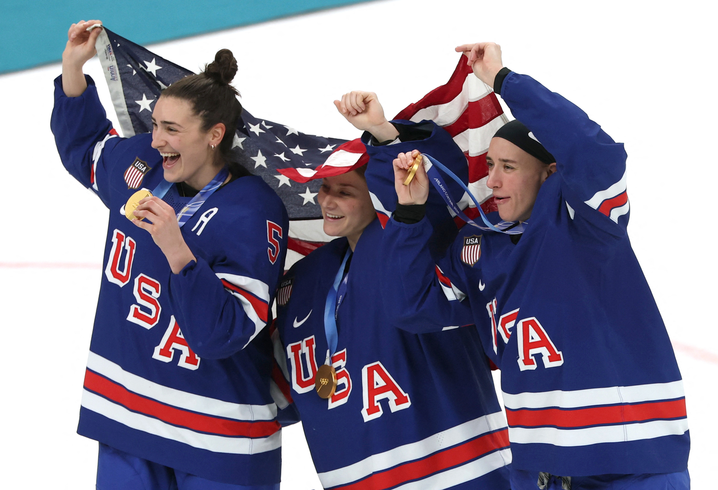 US women’s ice hockey players celebrate Megan Keller's winning goal against Canada at the 2026 Winter Olympics.