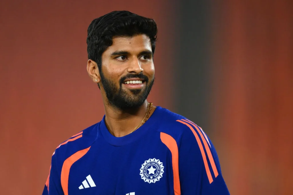 Washington Sundar bowling against South Africa while Axar Patel watches from the dugout during Super 8 match.