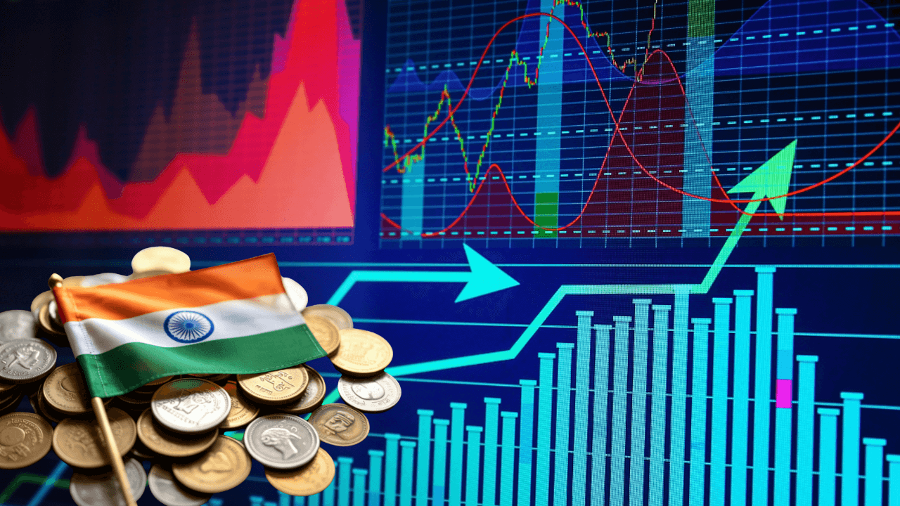 Stock market chart showing a downward trend with the Indian national flag and coins in the foreground.