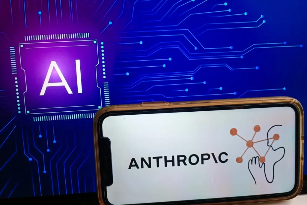 Logo of Anthropic AI displayed on a smartphone screen against a digital circuit background.