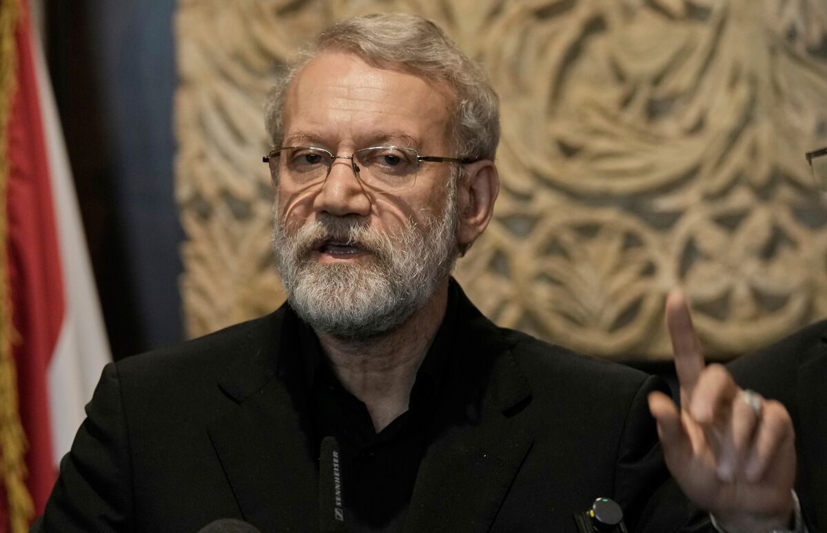 Iranian official Ali Larijani speaking at a podium prior to the recent escalation in Middle East conflict.