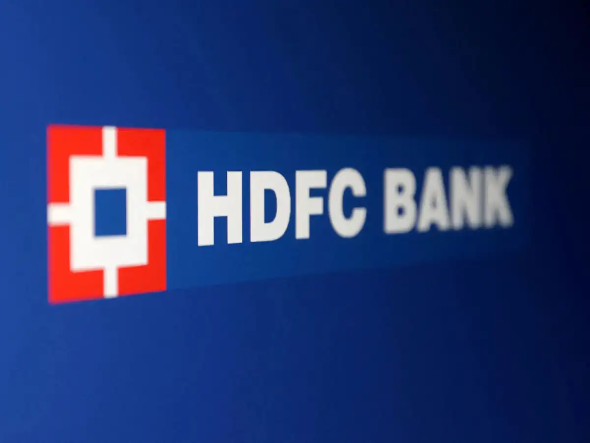 HDFC Bank signage against a red downward stock market trend line.