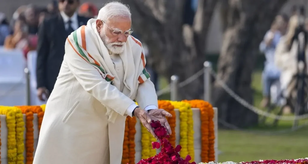 PM Modi paying floral tribute to Bhagat Singh, Rajguru, and Sukhdev on Shaheed Diwas in India.