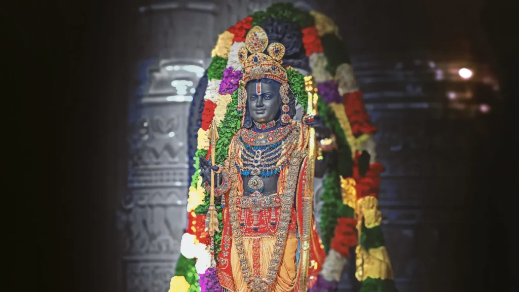 Devotees offering prayers and yellow flowers to Lord Rama idols during Ram Navami 2026 celebrations in India.