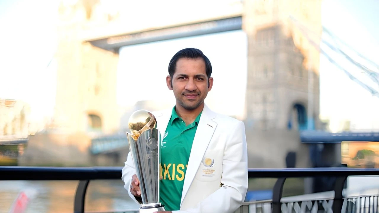 Former Pakistan cricket captain Sarfaraz Ahmed holding the 2017 ICC Champions Trophy.