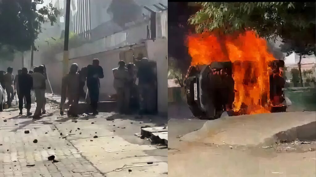 Burned cars and blocked roads during Noida workers protest against Haryana employment rules.