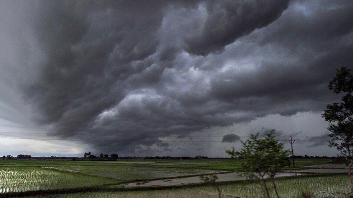 Rain clouds over Indian agricultural fields showing impact of El Nino on Monsoon.