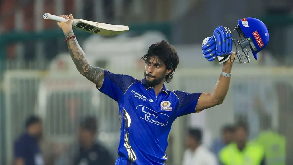 Tilak Varma celebrating his century against Gujarat Titans during IPL 2026 at Wankhede Stadium.