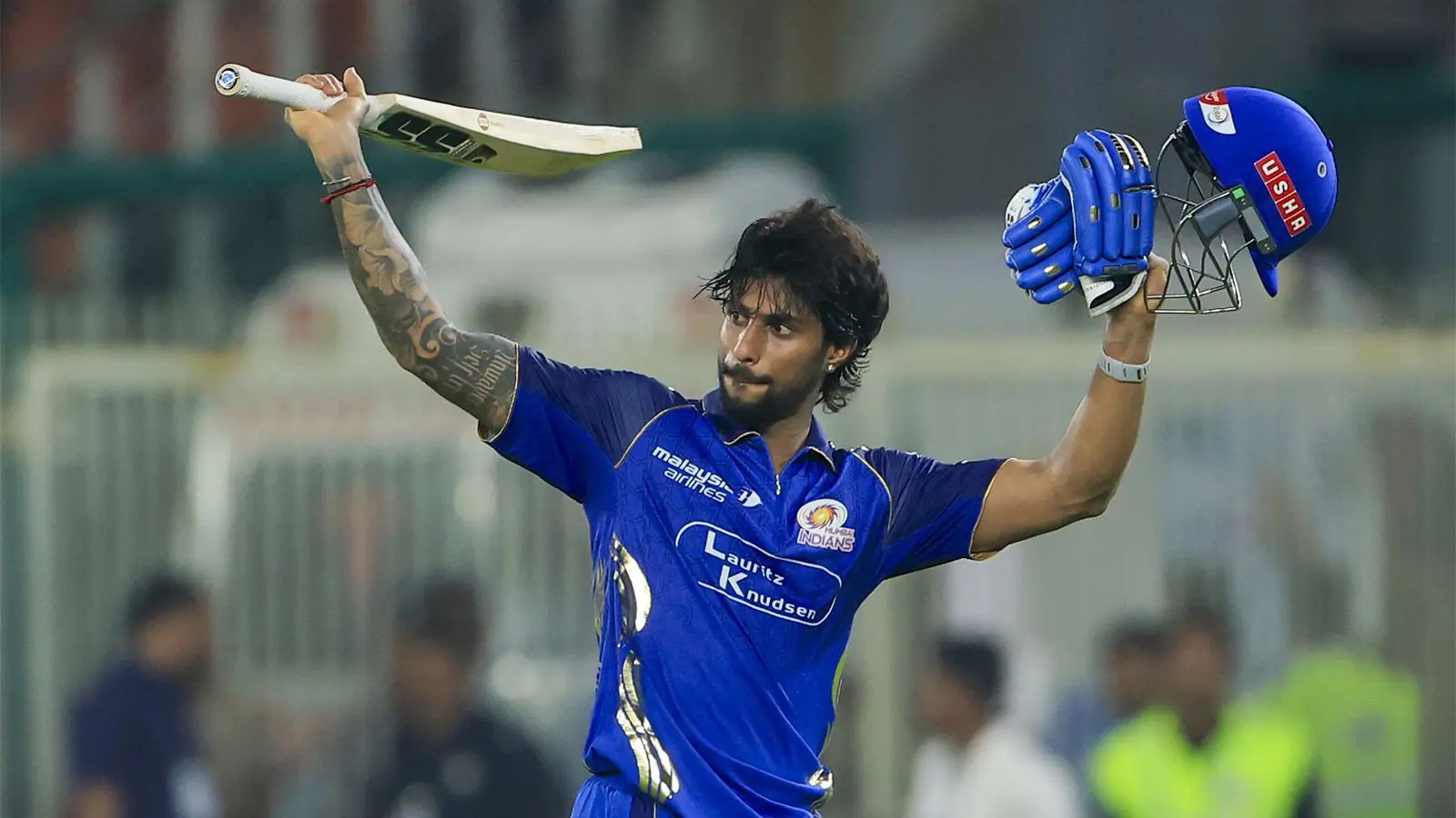 Tilak Varma celebrating his century against Gujarat Titans during IPL 2026 at Wankhede Stadium.