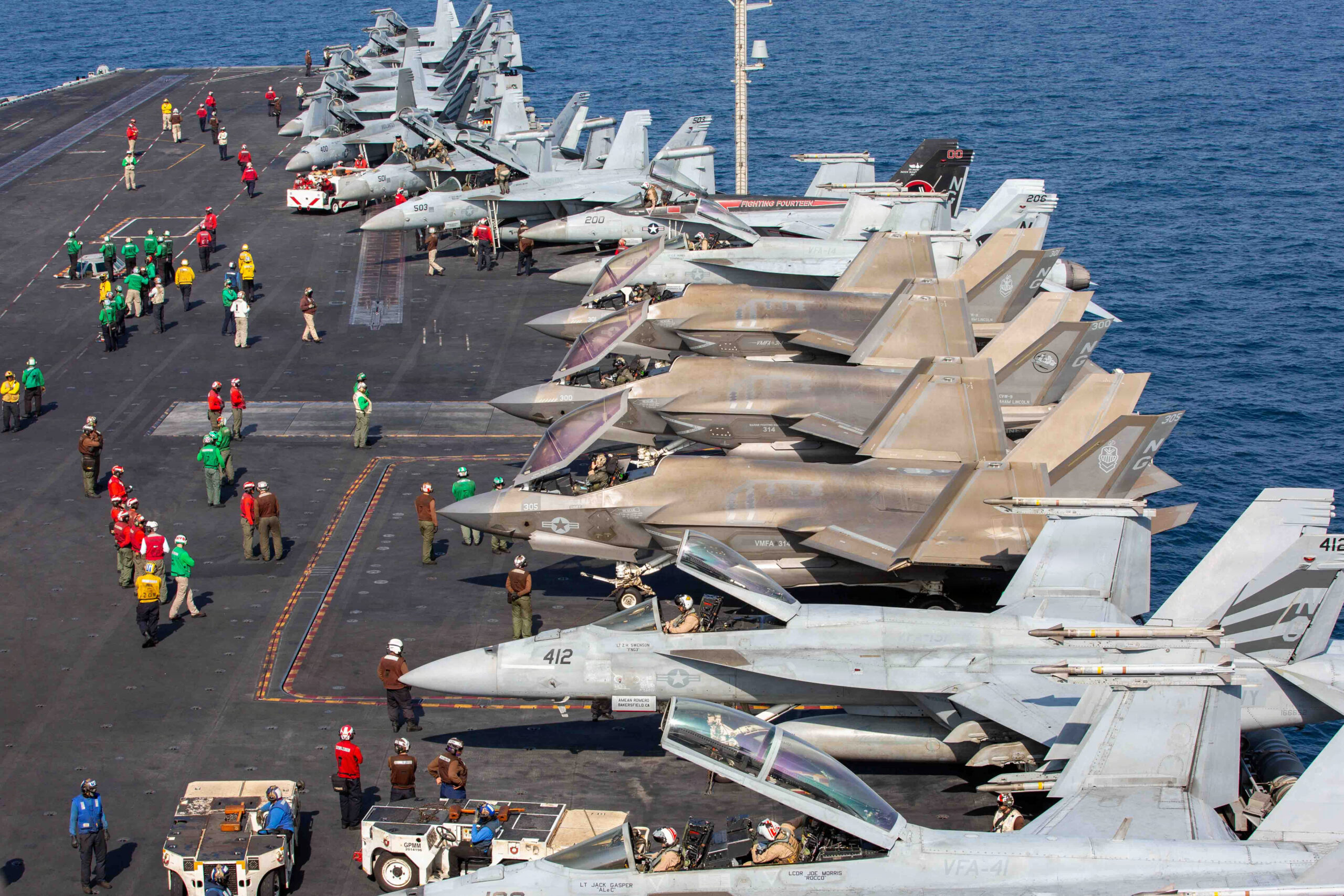 US Navy fighter jets launching from USS Abraham Lincoln for Operation Epic Fury against Iran targets.