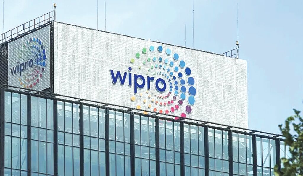 Wipro corporate office with stock market red arrow indicating share price drop