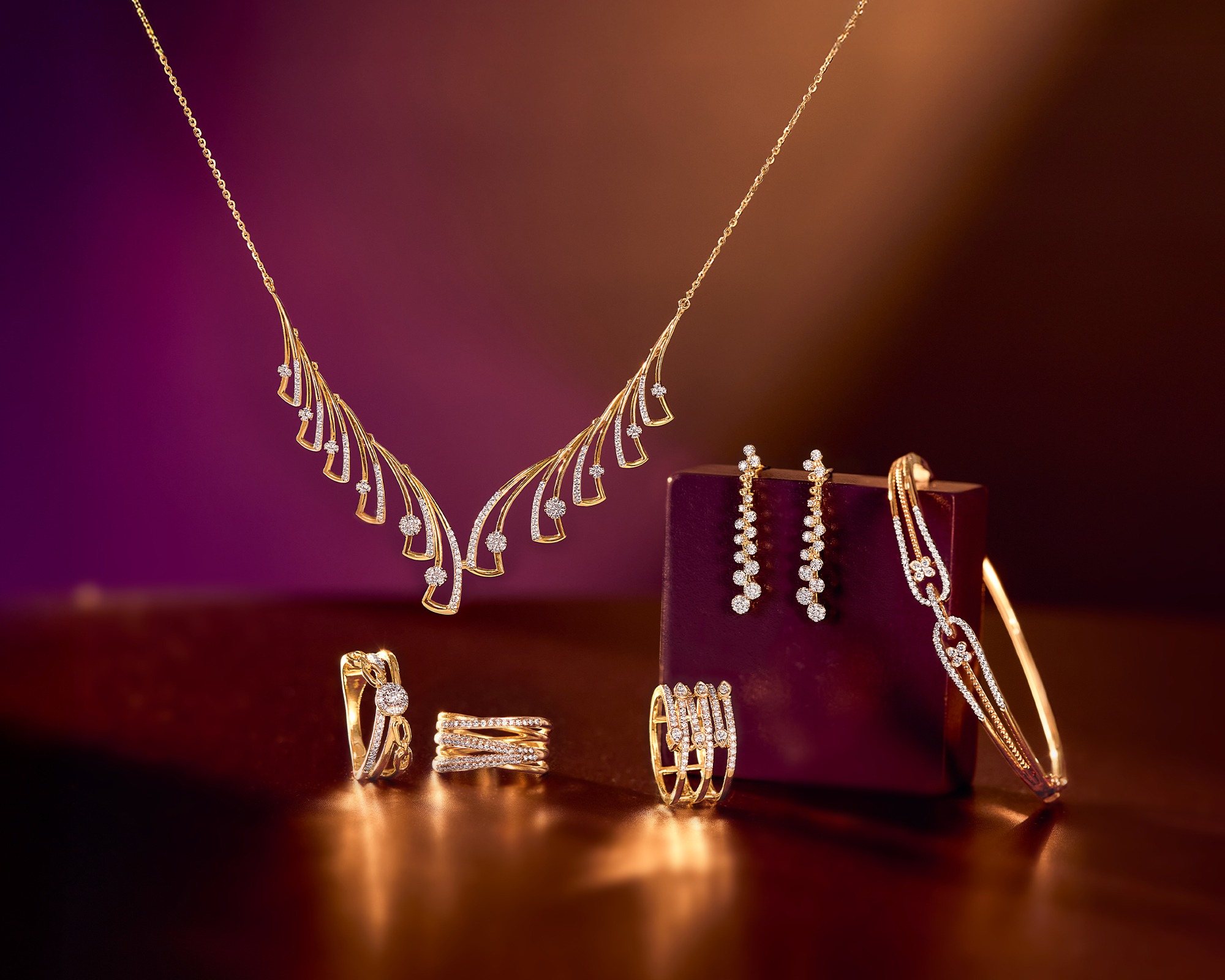 Gold price fluctuations in India on May 12, 2026, featuring major jewelry brands like Tanishq and Malabar Gold.