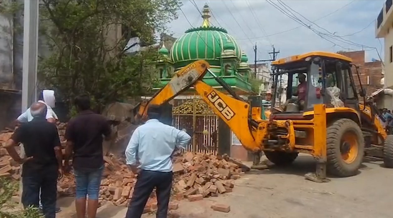 Boundary wall of a Dargah removed for road widening on Rewa's Amahiya Road.