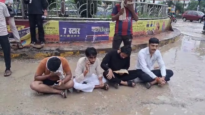 Youth stage unique protest against dilapidated road at Rewa's College Square.